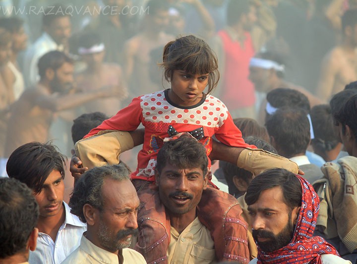 FATHER AND DAGUHTER IN A VILLAGE FESTIVAL
