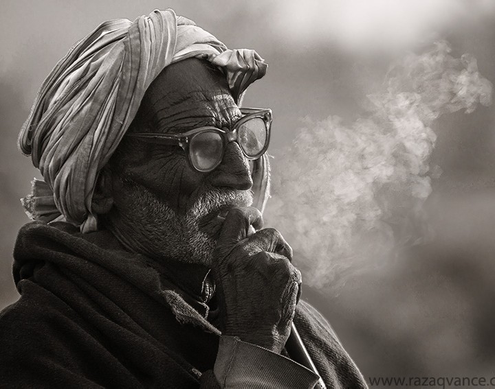 BLACK AND WHITE PORTRAIT OF A FARMER FROM ASIA