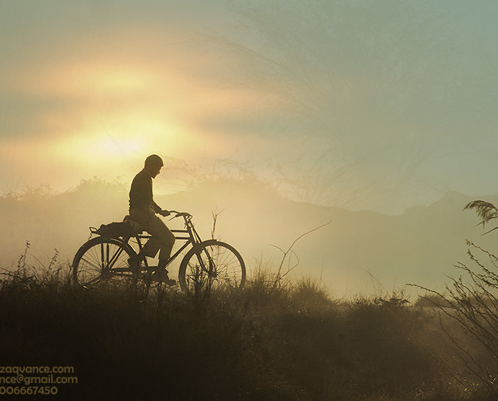LONE RIDER-A STUDENT GOING TO SCHOOL IN A VIBRANT MORNING